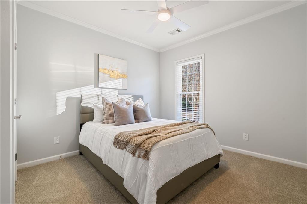 5090 Duke Drive Cumming, GA 30040 - Photo 46 of 65 a bedroom with a bed and window