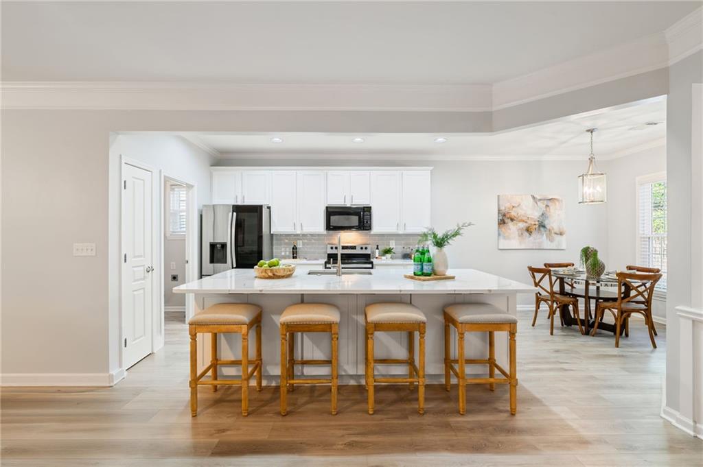5090 Duke Drive Cumming, GA 30040 - Photo 5 of 65 a view of a dining room with furniture