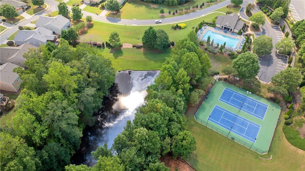5090 Duke Drive Cumming, GA 30040 - Photo 65 of 65 an aerial view of a house with outdoor space and a lake view