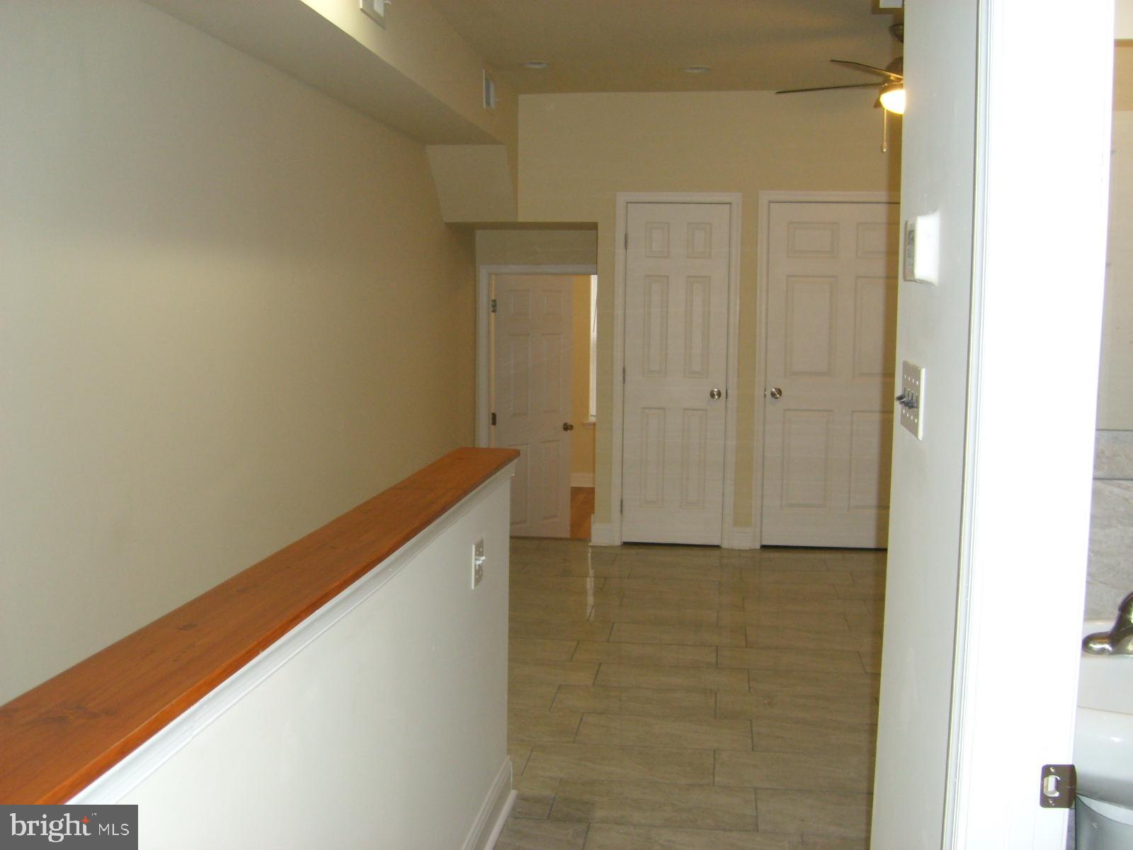 3838 Aspen Street Philadelphia, PA 19104 - Photo 10 of 15 a view of a hallway with wooden floor