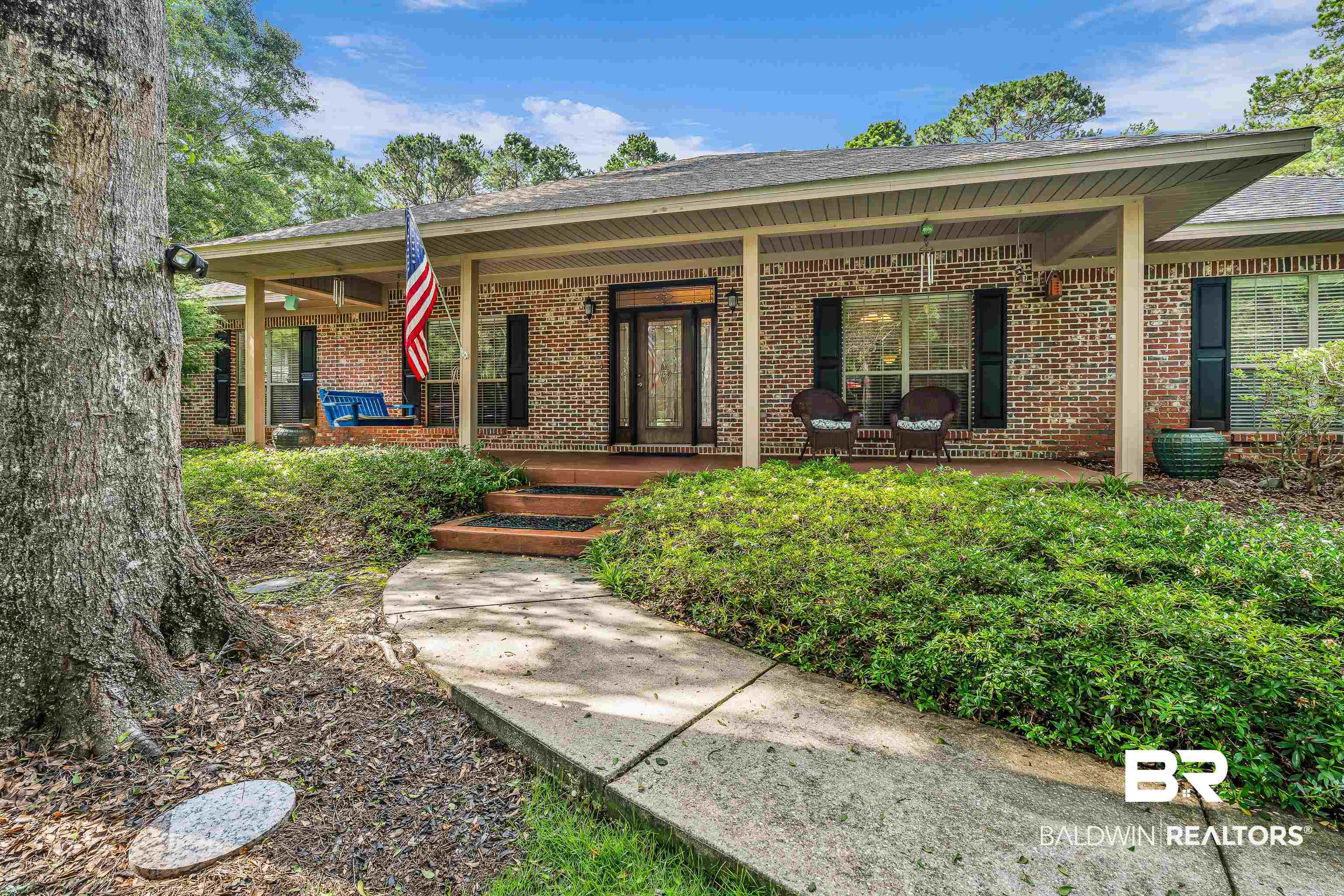 7014 Blakeley Road Daphne, AL 36527 - Photo 1 of 45 Brick exterior with a covered porch