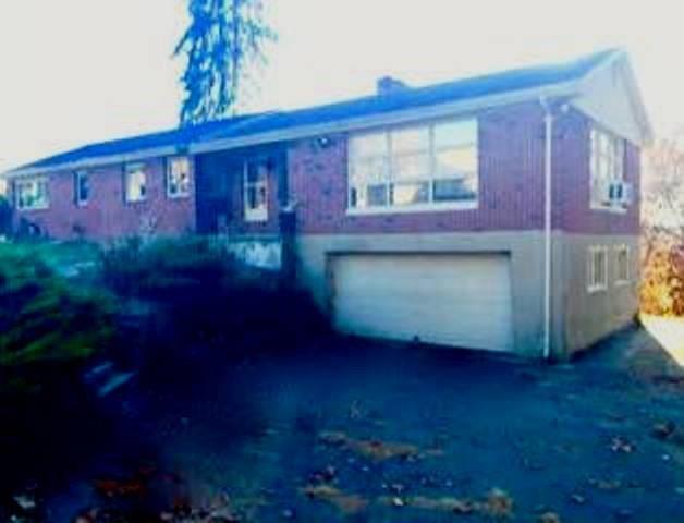 a front view of a house with yard