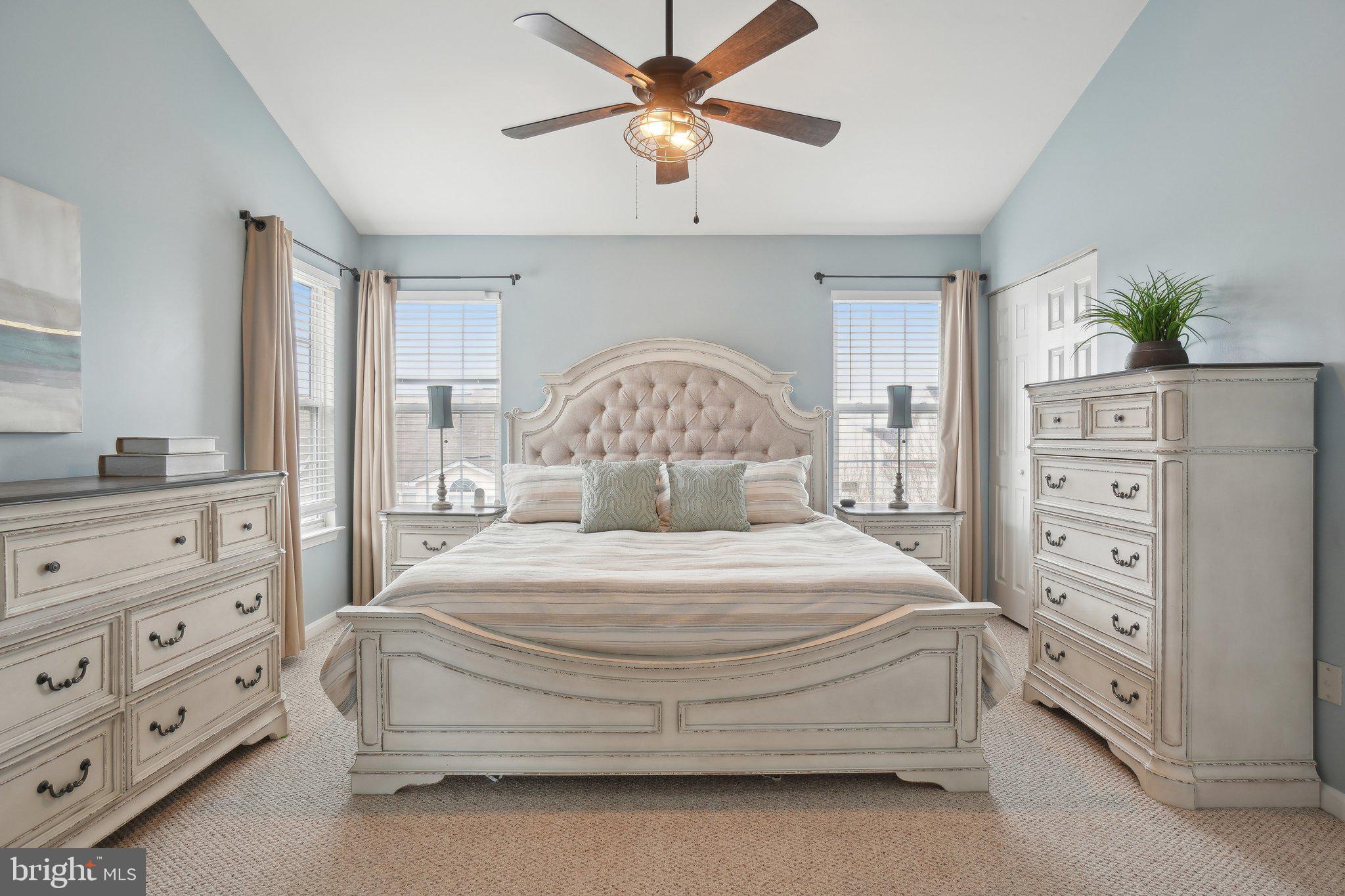 25379 Bryson Drive Chantilly, VA 20152 - Photo 15 of 28 a bedroom with a bed and a chandelier