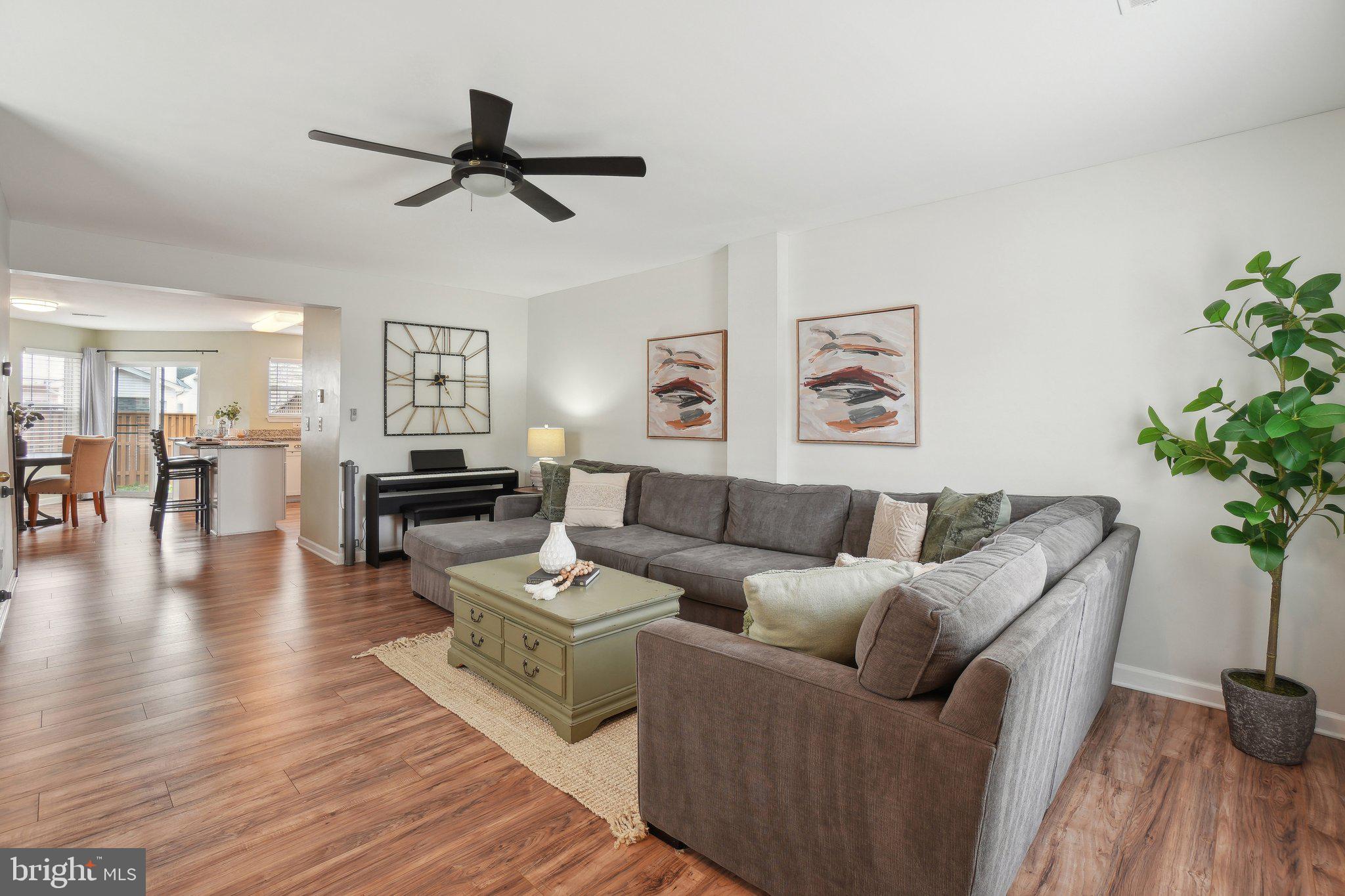 25379 Bryson Drive Chantilly, VA 20152 - Photo 2 of 28 a living room with furniture and a wooden floor