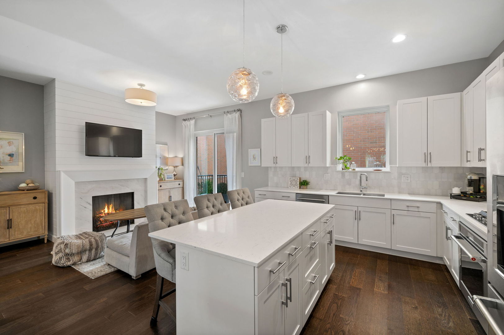 232 East 18th Street Chicago, IL 60616 - Photo 12 of 39 a kitchen with a sink stove a refrigerator and white cabinets
