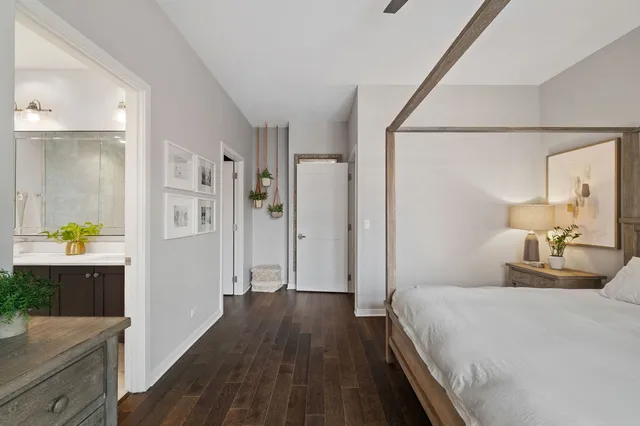 a bedroom with a bed and a dresser