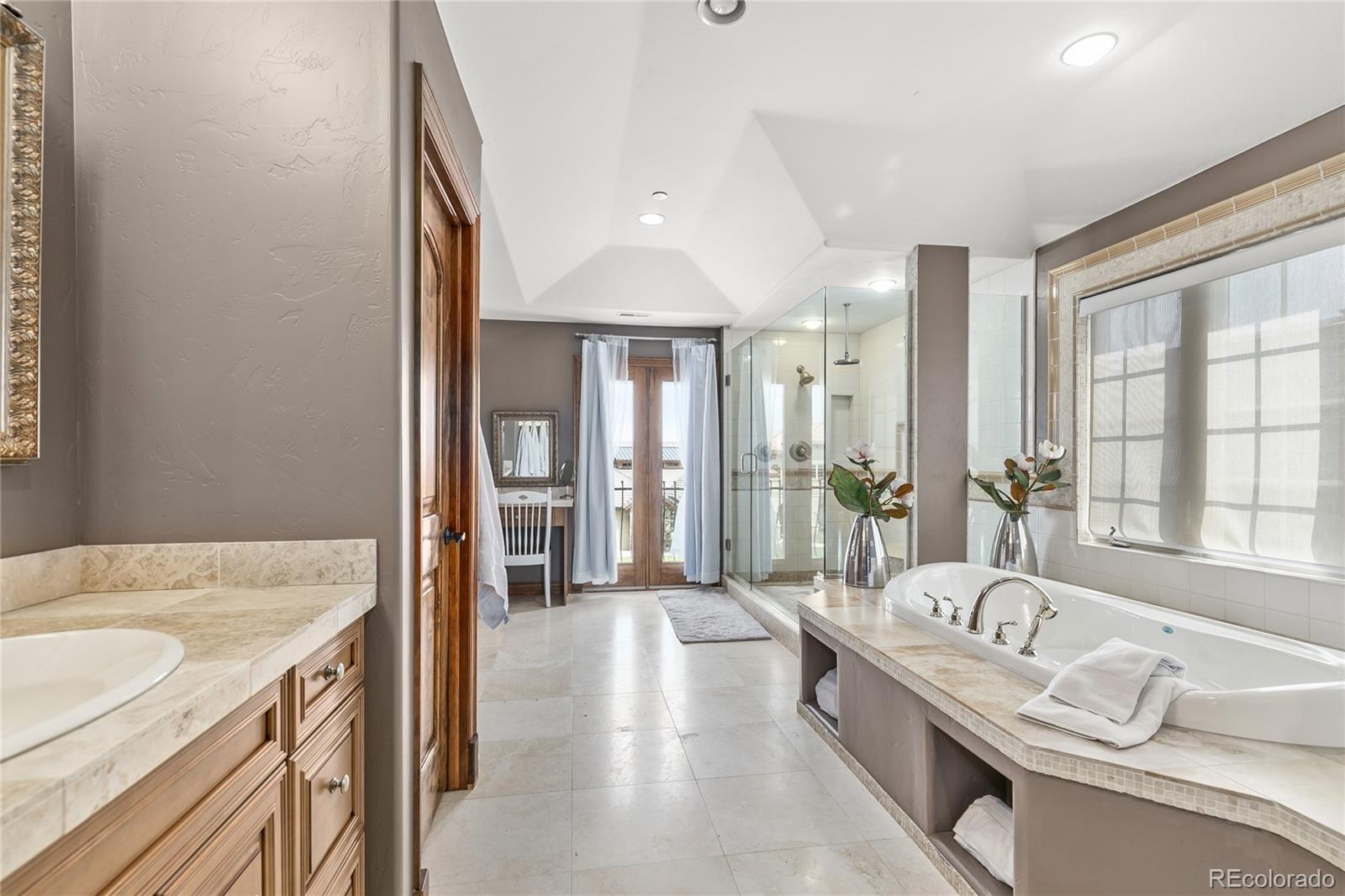 1295 Buffalo Ridge Road Castle Pines, CO 80108 - Photo 16 of 29 a large white kitchen with a large window