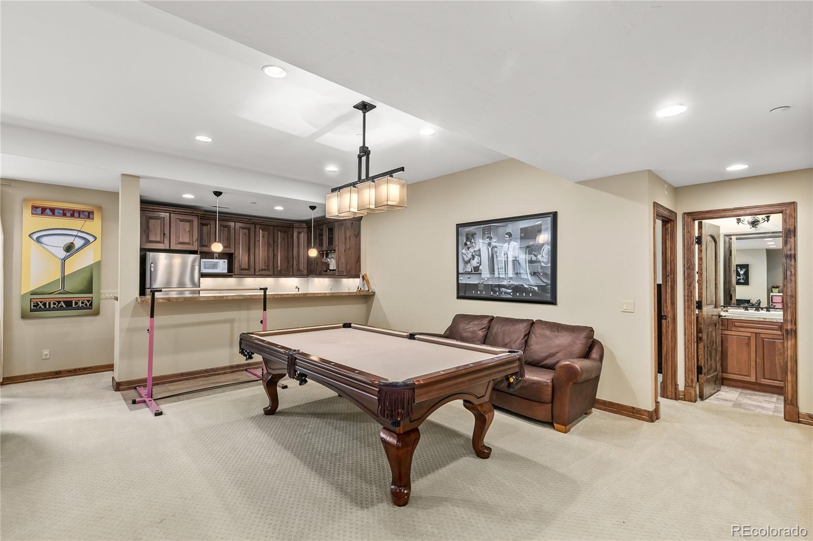 1295 Buffalo Ridge Road Castle Pines, CO 80108 - Photo 22 of 29 a living room with furniture and kitchen view