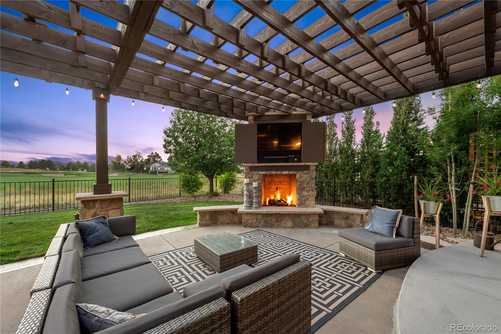 1295 Buffalo Ridge Road Castle Pines, CO 80108 - Photo 4 of 29 a outdoor living space with furniture and a garden