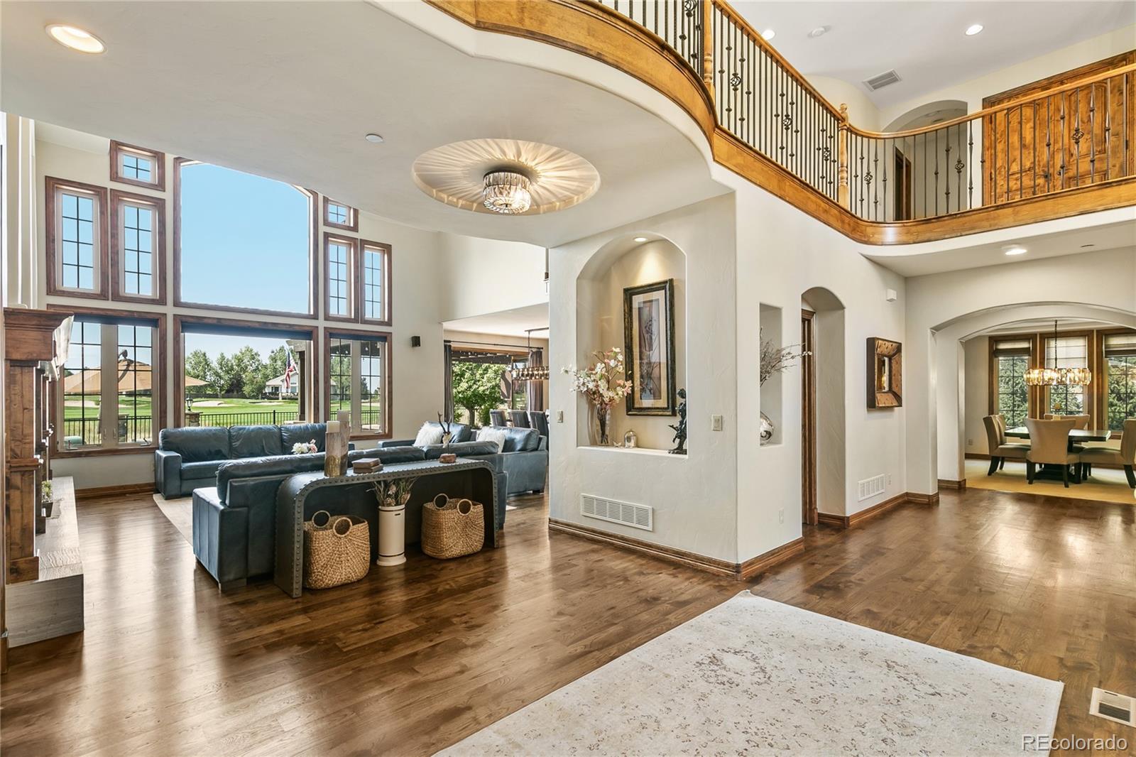 1295 Buffalo Ridge Road Castle Pines, CO 80108 - Photo 10 of 29 a living room with fireplace furniture and a large window