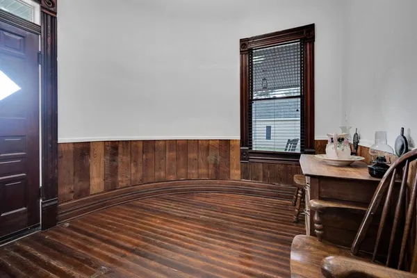 a view of a room with furniture window and wooden floor