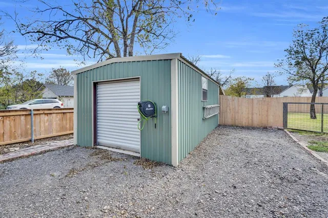 an aerial view of a house with a swimming pool