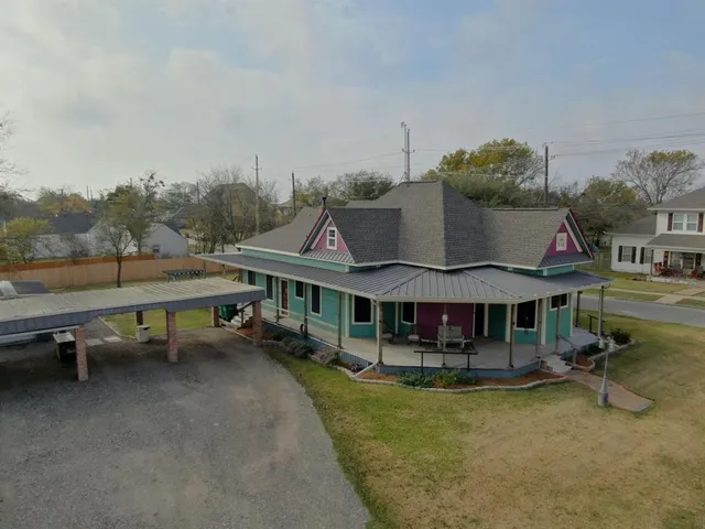 an aerial view of residential houses with outdoor space