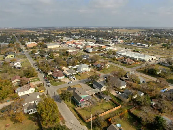 an aerial view of residential building and parking space