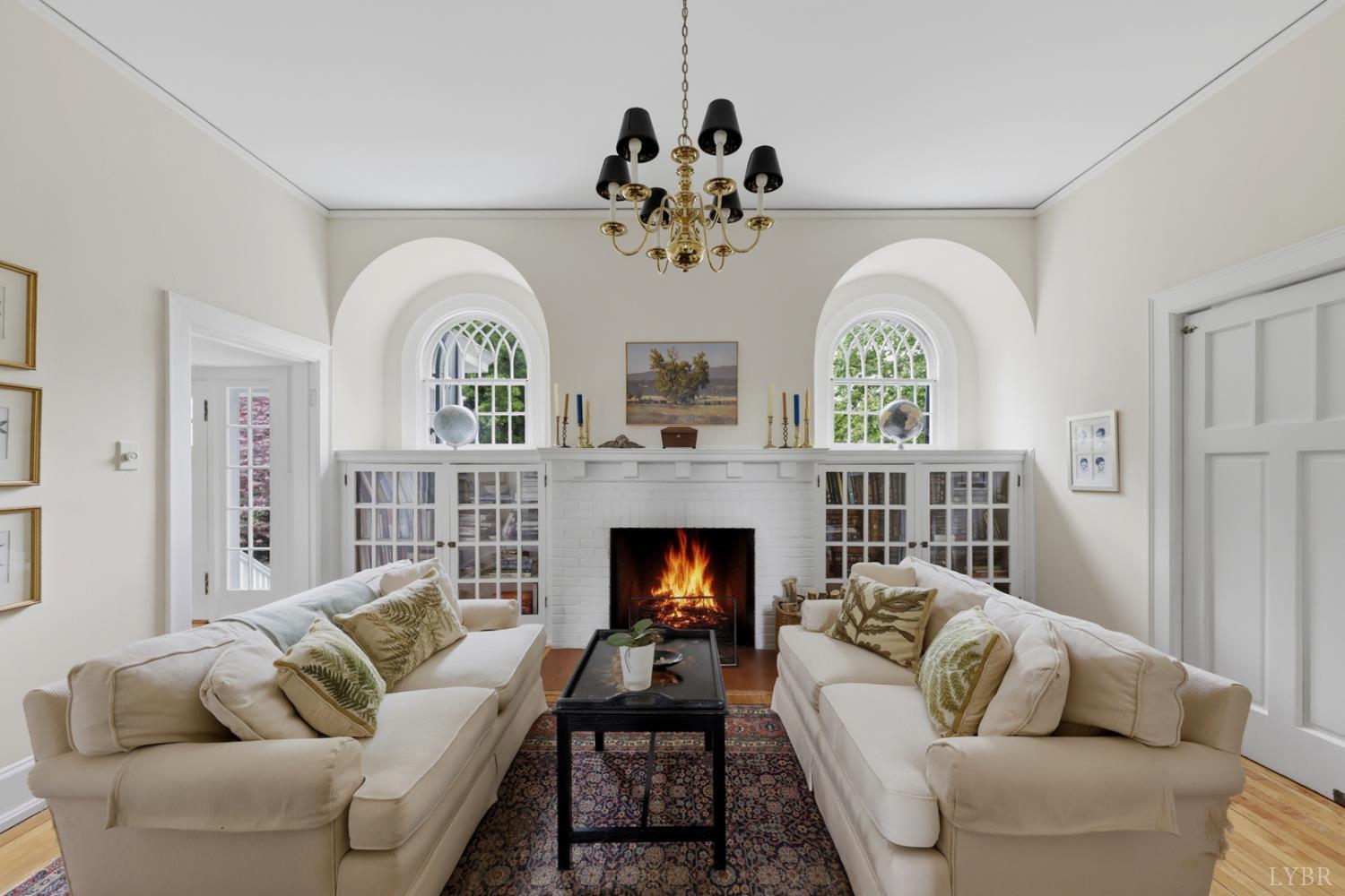 1304 Langhorne Road Lynchburg, VA 24503 - Photo 53 of 96 a living room with furniture a fireplace and a chandelier