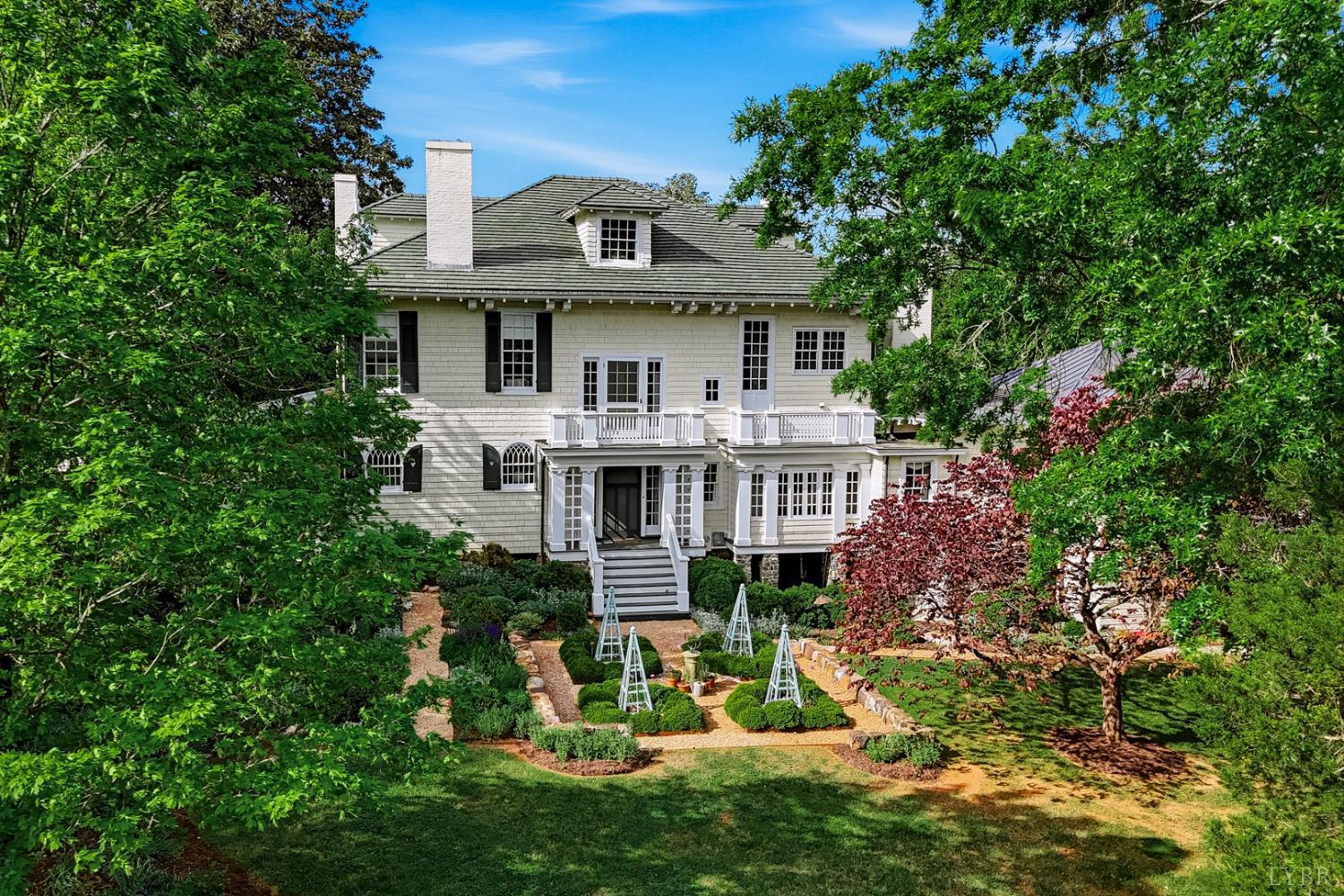 1304 Langhorne Road Lynchburg, VA 24503 - Photo 6 of 96 a view of a house with a big yard plants and large trees