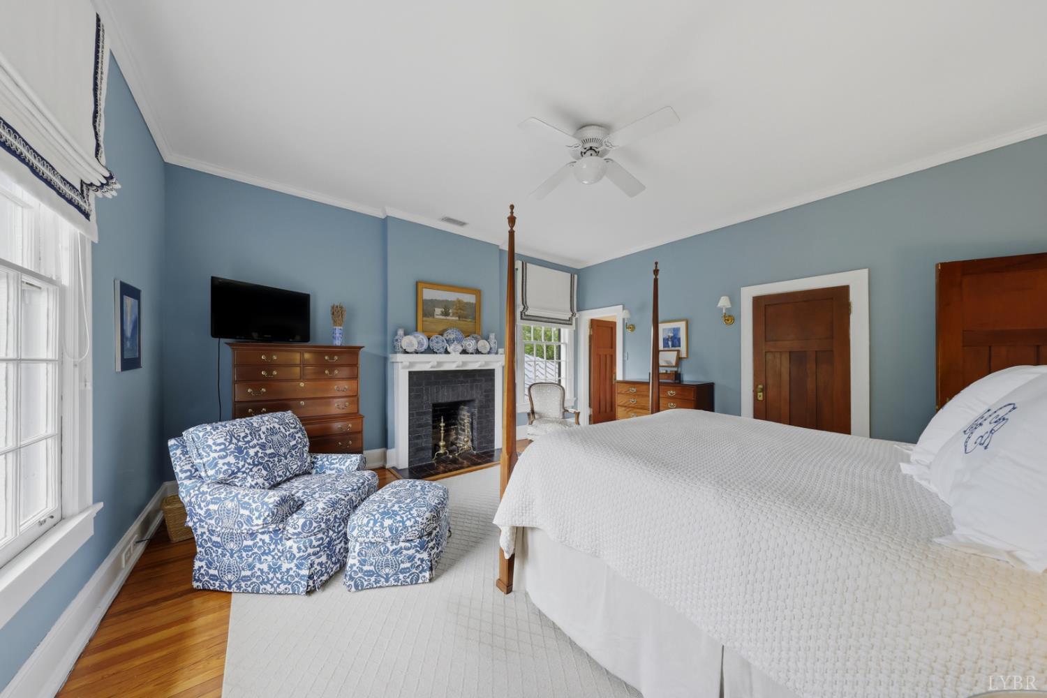 1304 Langhorne Road Lynchburg, VA 24503 - Photo 63 of 96 a living room with furniture a flat screen tv and a fireplace