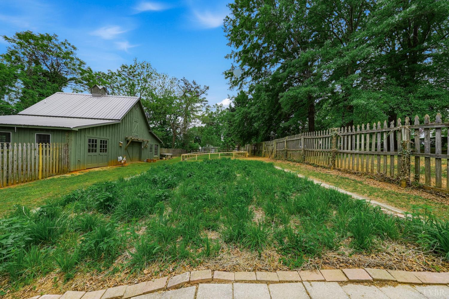 1304 Langhorne Road Lynchburg, VA 24503 - Photo 85 of 96 a view of a house with a backyard and a garden