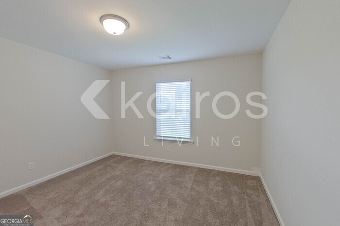 108 St Phillip Way Springfield, GA 31329 - Photo 14 of 29 an empty room with windows