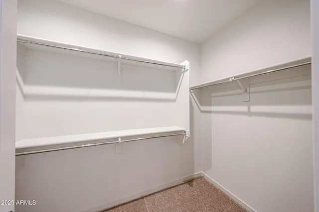a view of an empty walk in closet