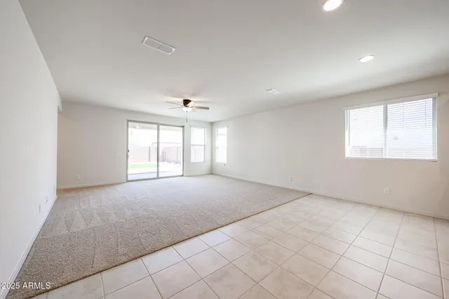 a view of an empty room with windows