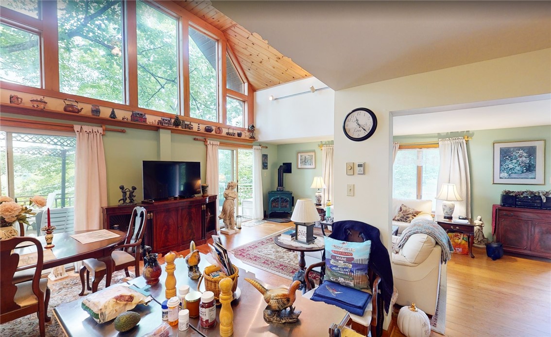 138 Vito Molinari Road Oneonta, NY 13820 - Photo 11 of 38 from the kitchen looking into the DR & LR with propane stove and doors to deck.