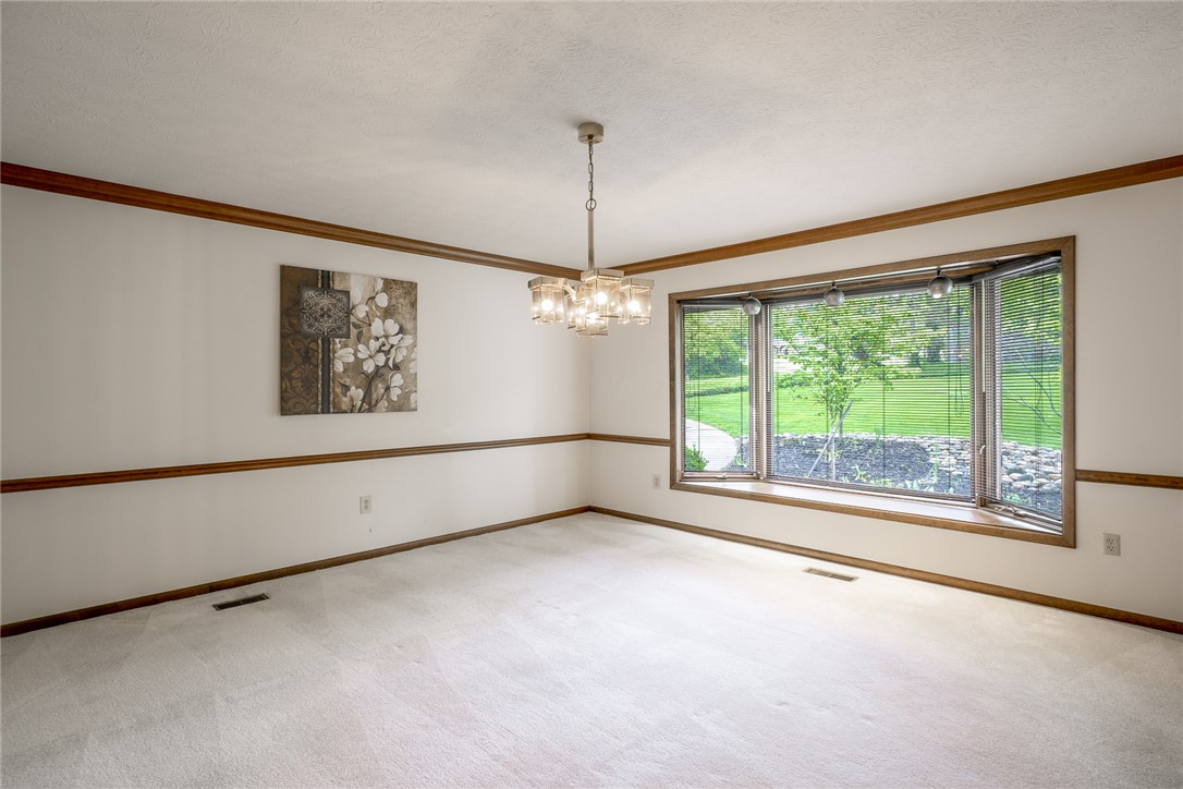 273 North Alpha Bellbrook Road Dayton, OH 45434 - Photo 4 of 43 This spacious room features a grand bay window overlooking lush greenery, perfect for gatherings.