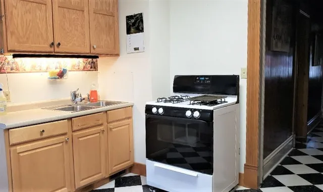a view of a chairs and table in the balcony