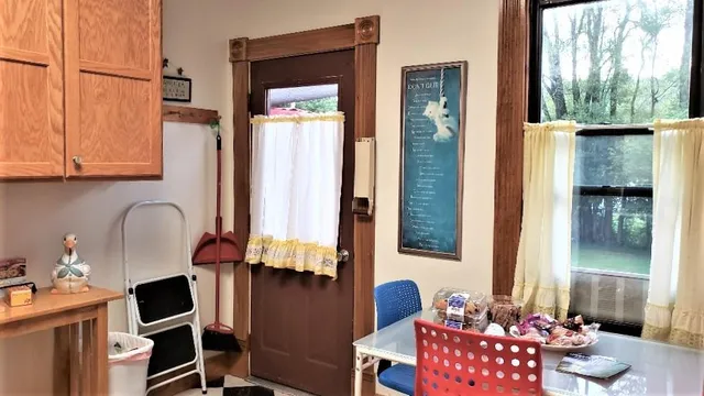 a front view of a house with outdoor seating