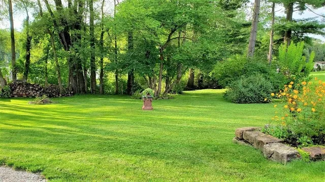 a brick building with trees in front of it