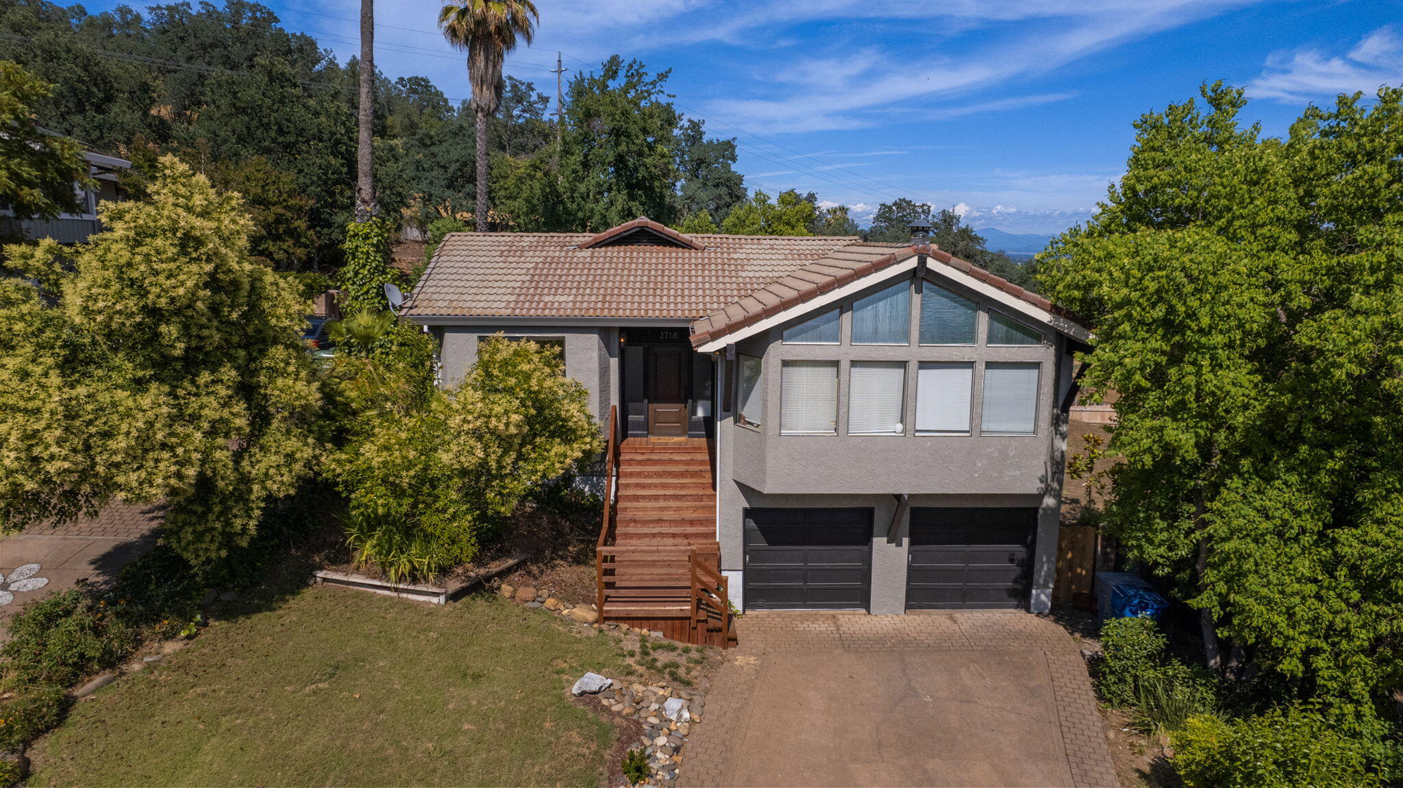 3718 Cal Ore Drive Redding, CA 96001 - Photo 1 of 28 a house with trees in the background