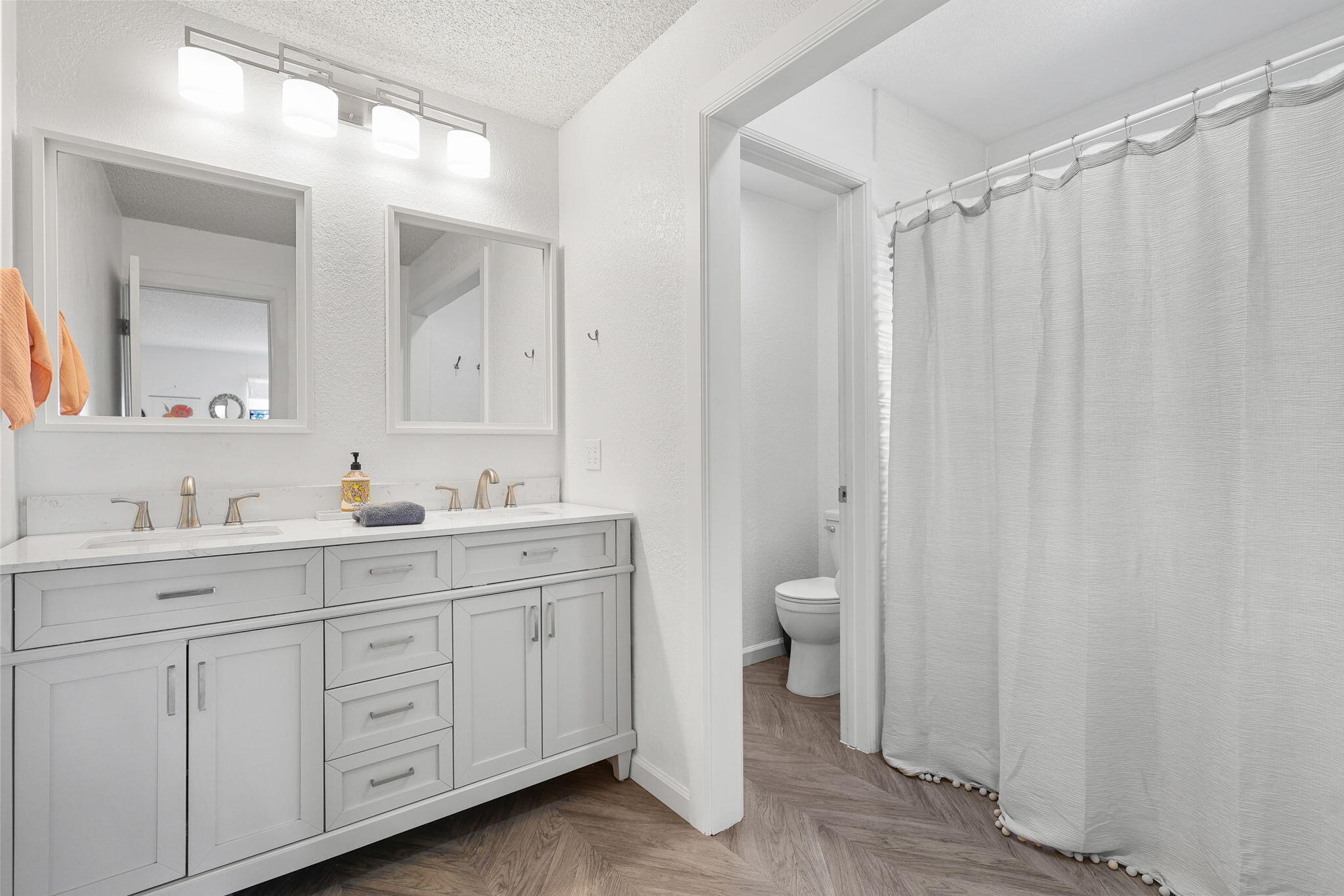 3718 Cal Ore Drive Redding, CA 96001 - Photo 13 of 28 a spacious bathroom with a double vanity sink toilet and a mirror