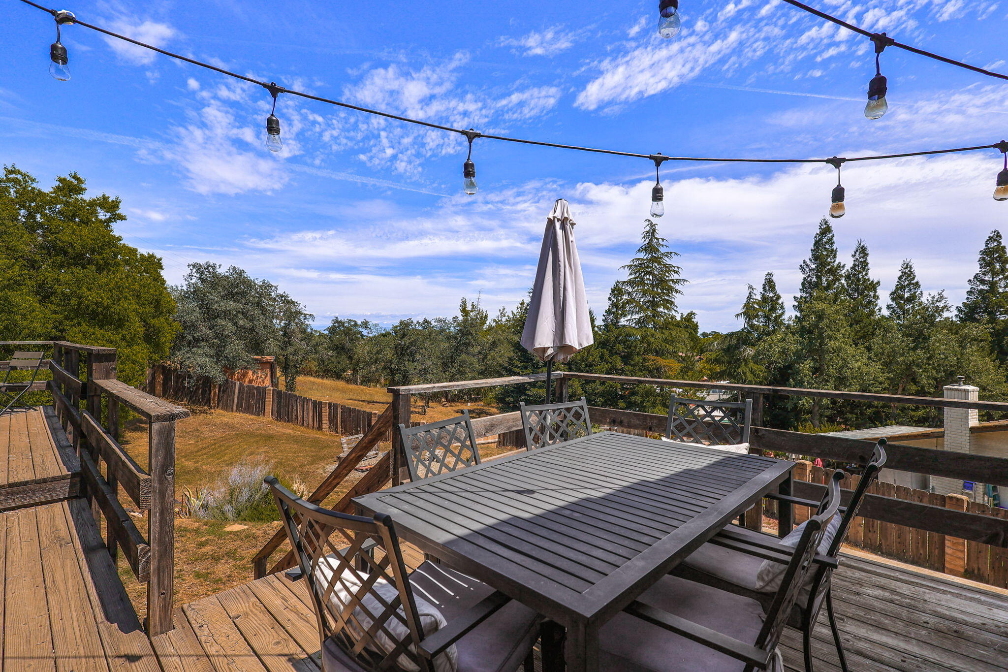 3718 Cal Ore Drive Redding, CA 96001 - Photo 20 of 28 a view of a roof deck with wooden floor and city view