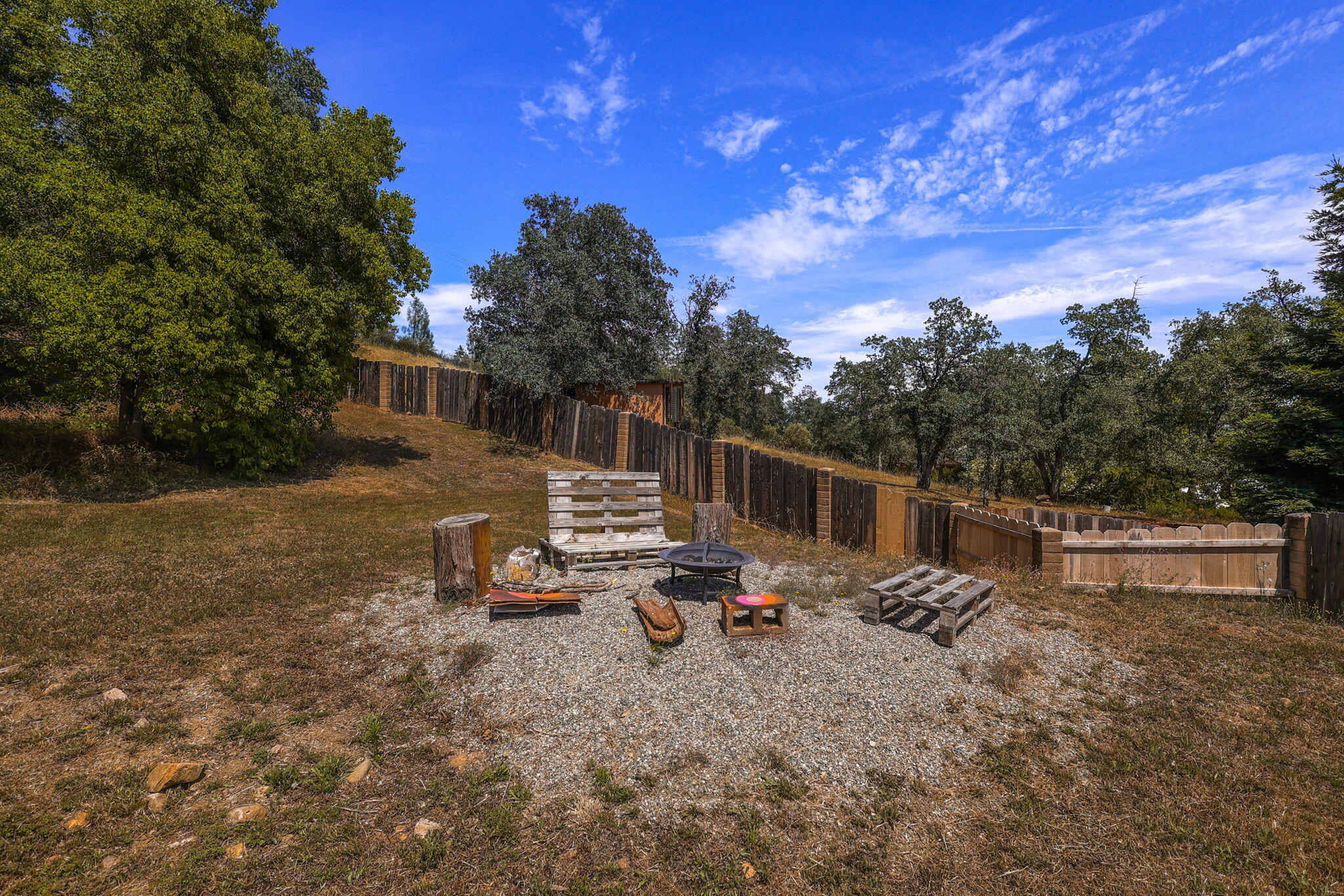 3718 Cal Ore Drive Redding, CA 96001 - Photo 23 of 28 a backyard of a house with table and chairs