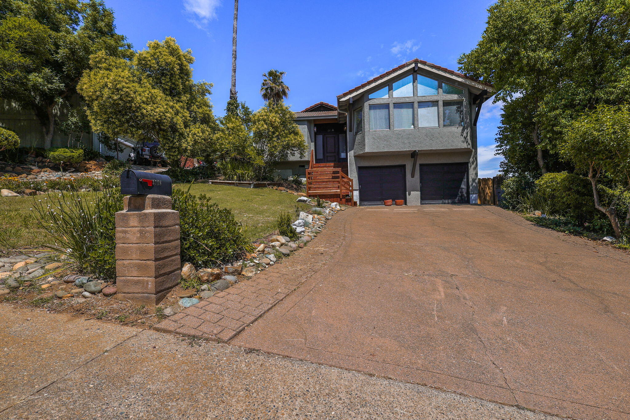 3718 Cal Ore Drive Redding, CA 96001 - Photo 25 of 28 a front view of a house with a garden