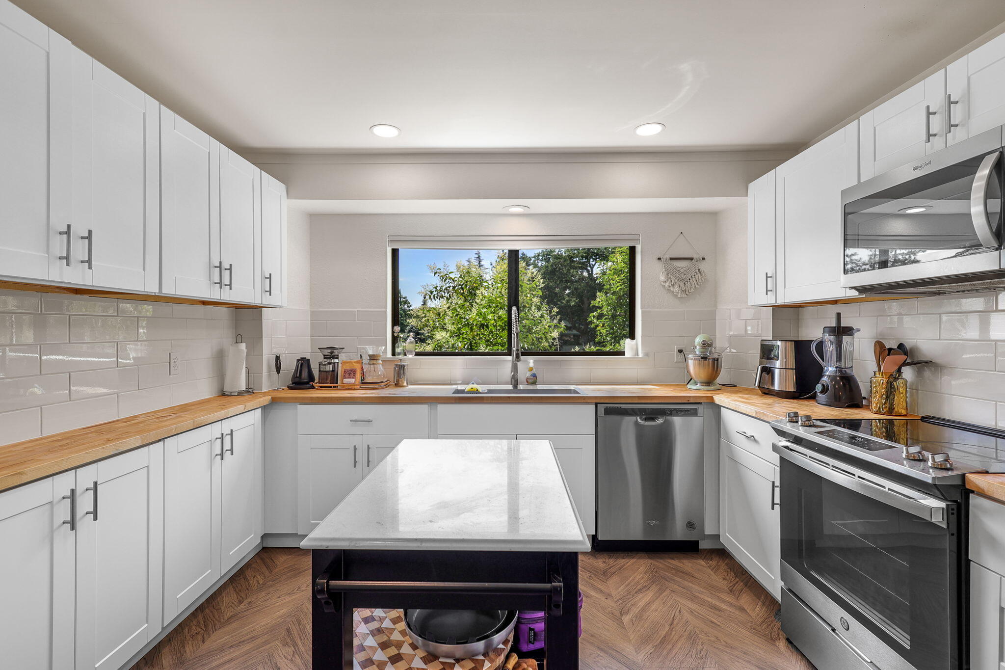 3718 Cal Ore Drive Redding, CA 96001 - Photo 7 of 28 a kitchen with a sink a stove and cabinets