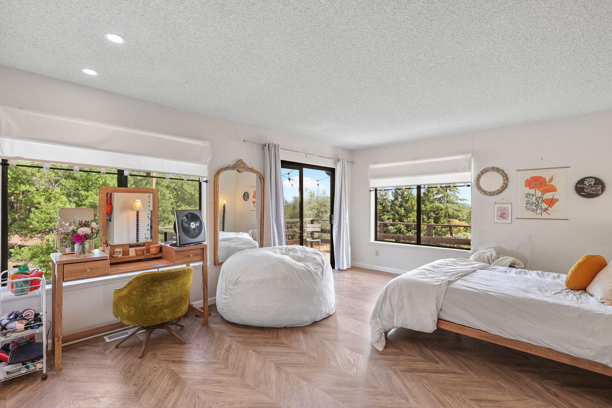 3718 Cal Ore Drive Redding, CA 96001 - Photo 10 of 28 a bedroom with a bed and large windows
