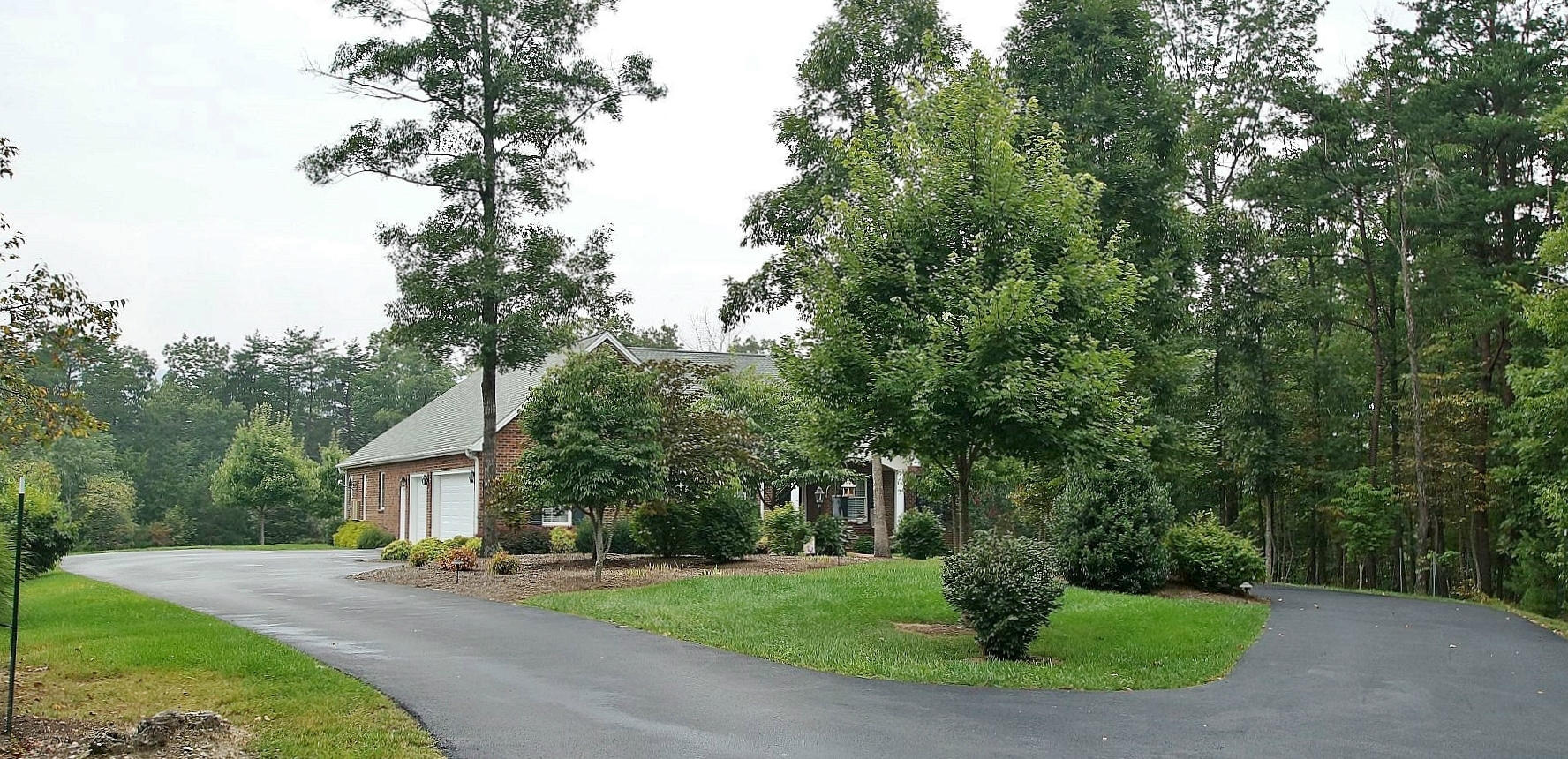 2865 New Ridge Road Elliston, VA 24087 - Photo 3 of 94 a front view of a house with a yard and trees