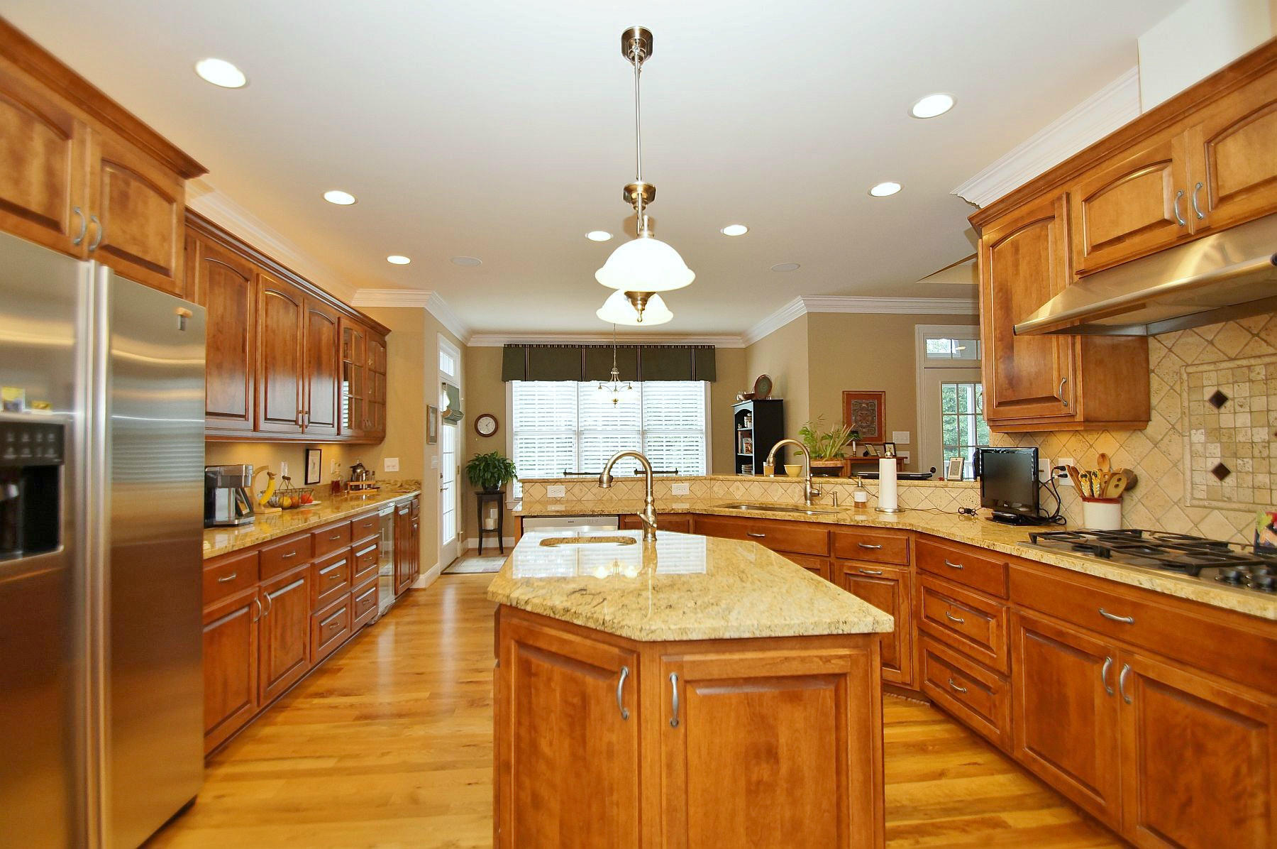 2865 New Ridge Road Elliston, VA 24087 - Photo 22 of 94 a kitchen with stainless steel appliances kitchen island granite countertop a sink a counter space and cabinets