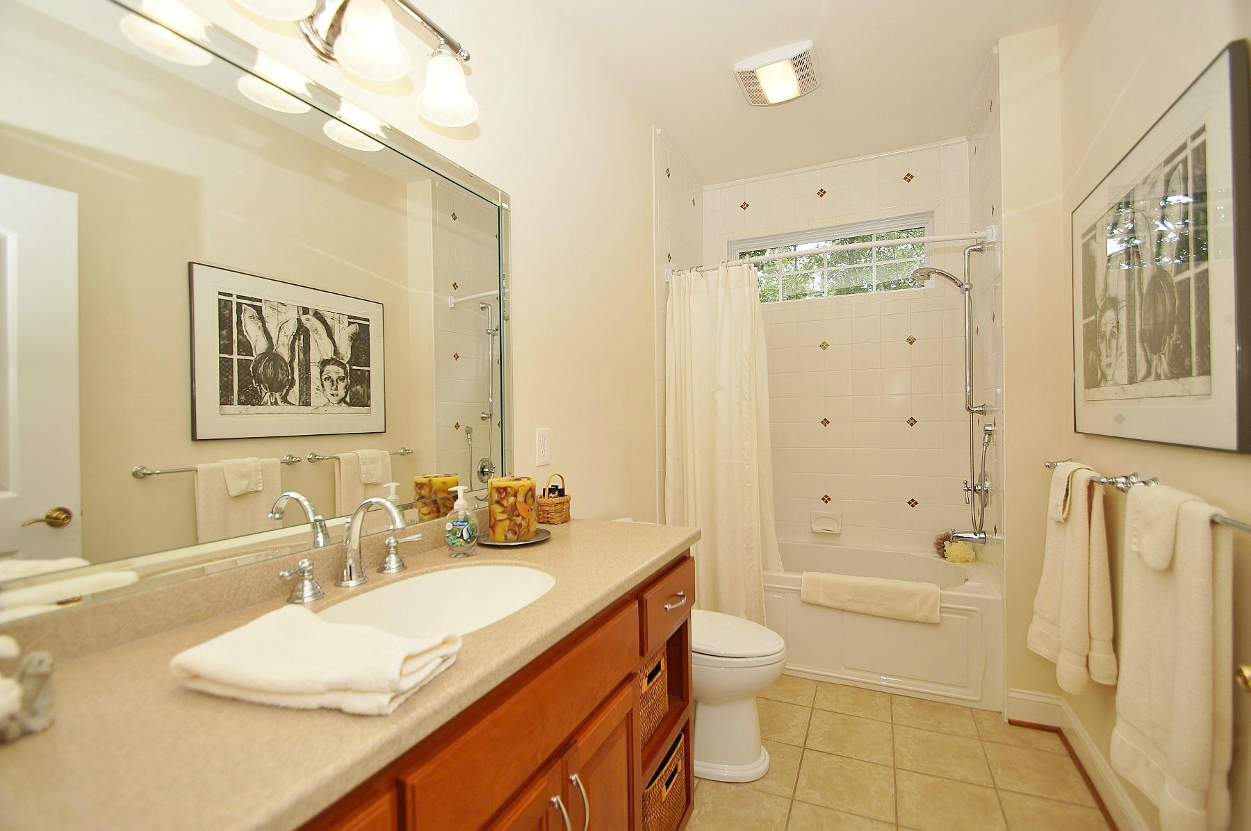 2865 New Ridge Road Elliston, VA 24087 - Photo 50 of 94 a bathroom with a granite countertop sink a toilet a mirror a vanity and shower