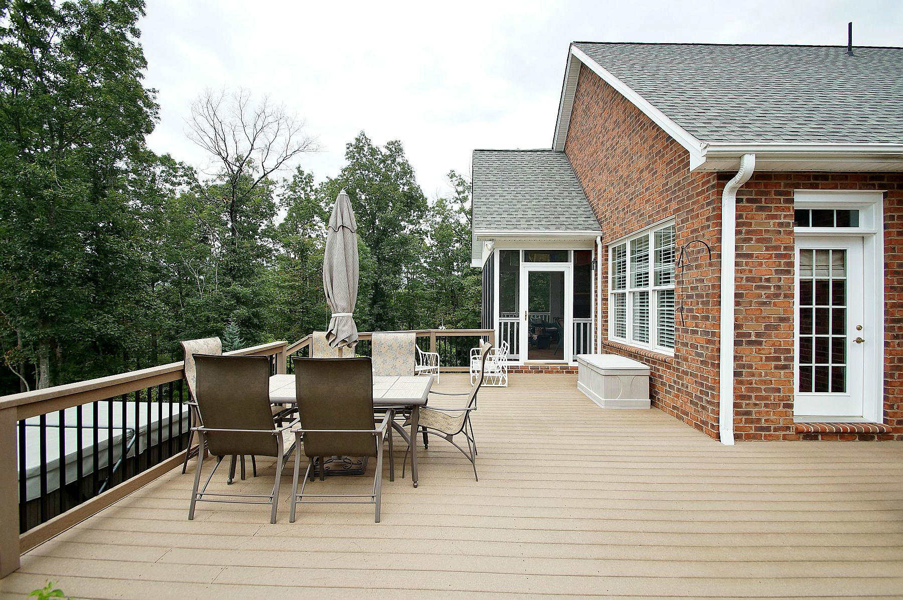 2865 New Ridge Road Elliston, VA 24087 - Photo 86 of 94 a view of a roof deck with table and chairs and wooden floor