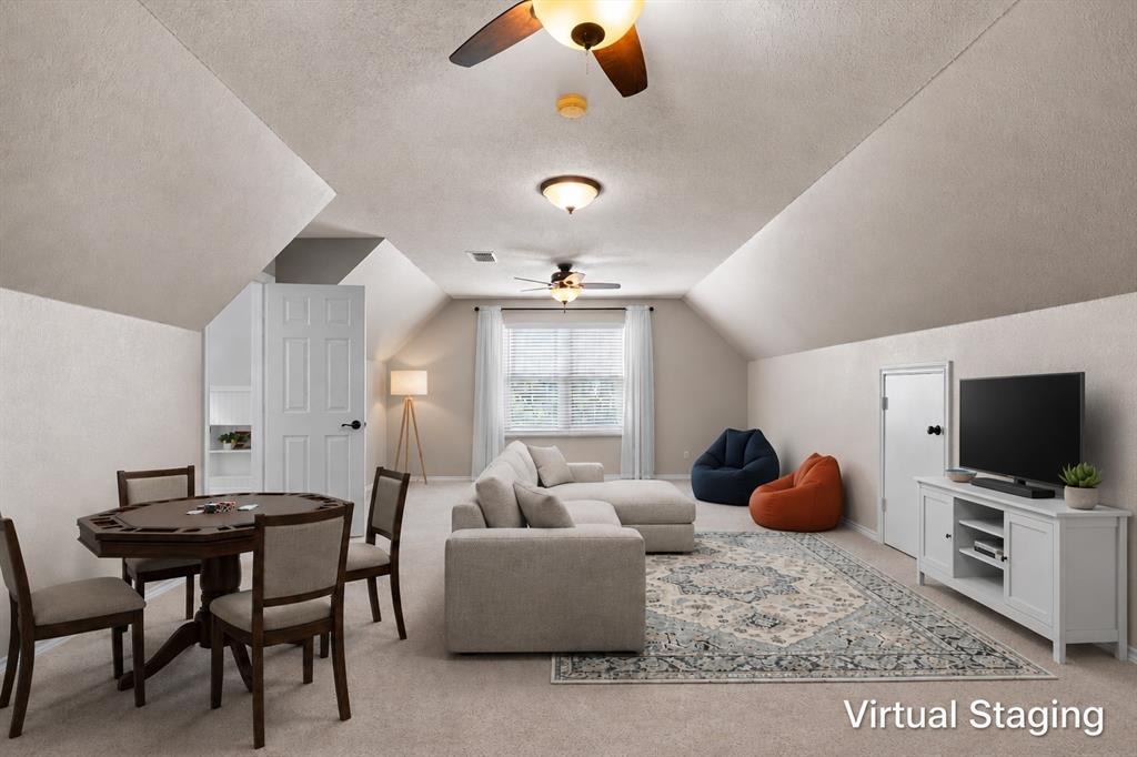 410 Simmons Road Double Oak, TX 75077 - Photo 23 of 40 Expansive upstairs game room with vaulted ceilings and endless flexibility for the whole family.