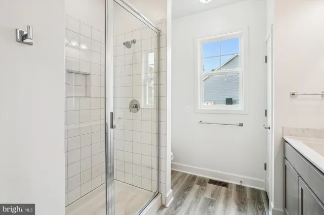 a bathroom with a sink double vanity and a mirror