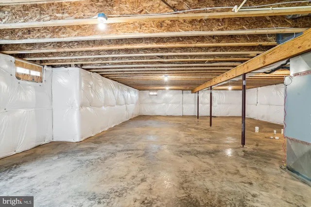 a view of storage and utility room with stairs