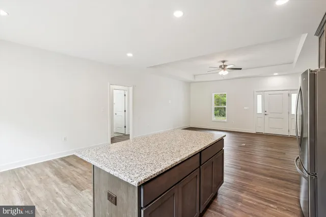 a view of kitchen with sink and wooden floor