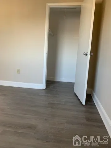 an empty room with wooden floor