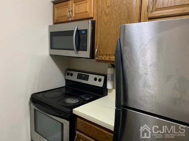 a close view of a stove and a microwave