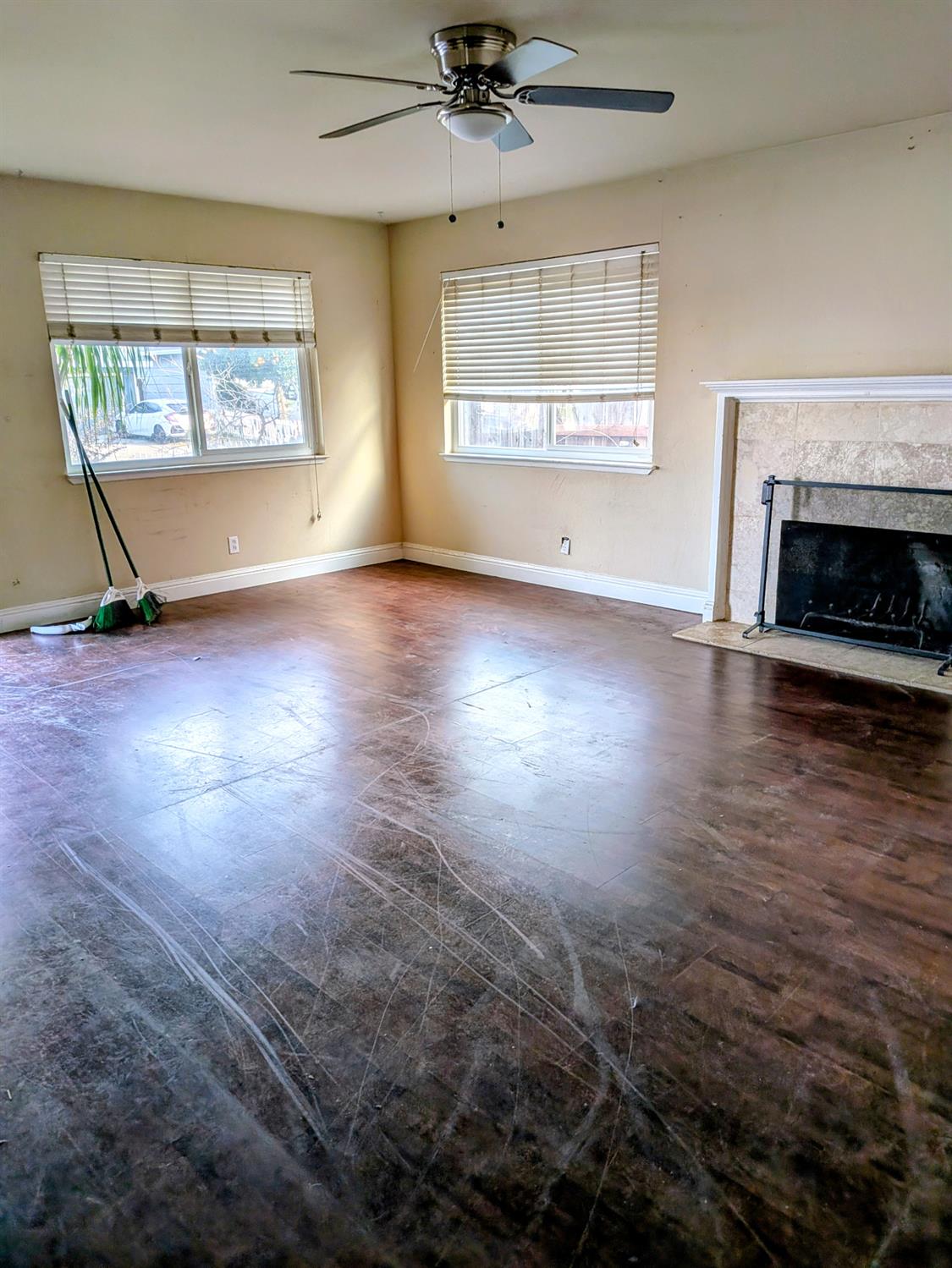 10517 Mills Acres Circle Rancho Cordova, CA 95670 - Photo 4 of 19 an empty room with wooden floor fireplace and windows