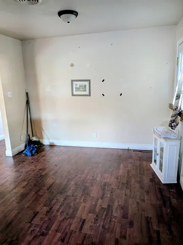 a view of a livingroom with wooden floor