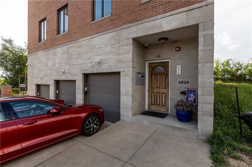 1825 Arcena Street, Unit 3 Pittsburgh, PA 15219 - Photo 2 of 31 a front view of a house with entryway